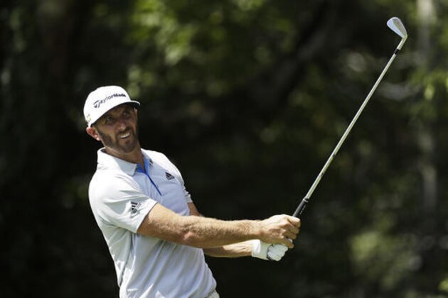 Dustin Johnson tees off on the second hole during the first round of the Tour Championship golf tournament at East Lake Golf Club in Atlanta, Thursday, Sept. 22, 2016. (AP Photo/David Goldman)