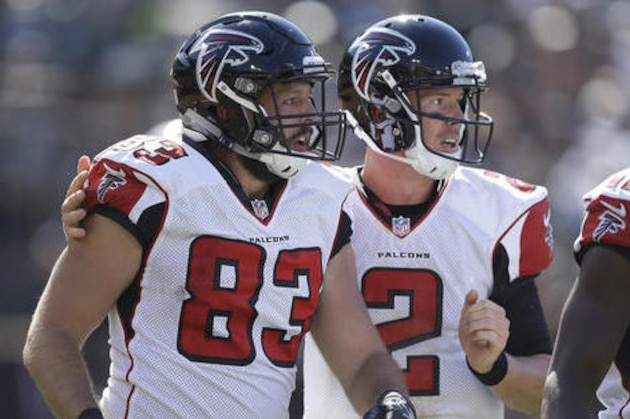 Atlanta Falcons tight end Jacob Tamme (83) and quarterback Matt Ryan (2) celebrate after connecting on a touchdown pass during the second half of an NFL football game against the Oakland Raiders in Oakland, Calif., Sunday, Sept. 18, 2016. (AP Photo/Ben Margot)