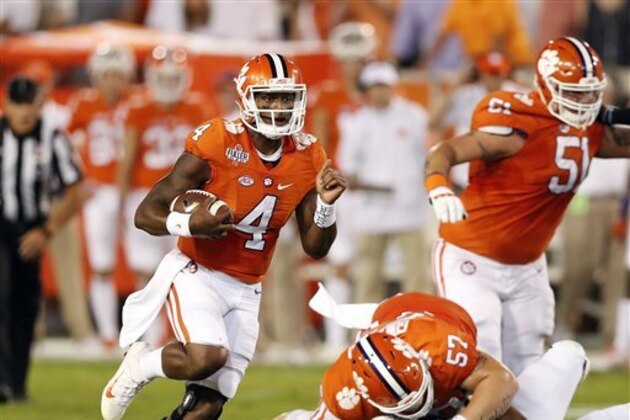 Clemson quarterback Deshaun Watson (4) breaks into the open field as  offensive lineman Jay Guillermo (57) blocks Georgia Tech defensive lineman Kyle Cerge-Henderson (54) in the first half of an NCAA college football game Thursday, Sept. 22, 2016, in Atlanta. (AP Photo/John Bazemore)