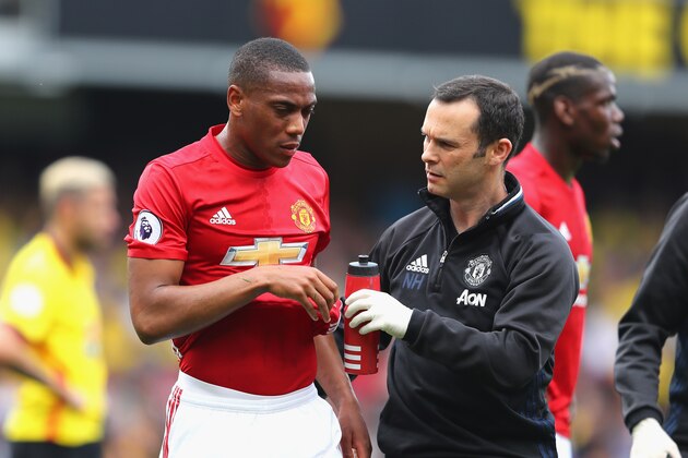 WATFORD, ENGLAND - SEPTEMBER 18:  Anthony Martial of Manchester United is taken off the pitch with a member of the Manchester United medial team  during the Premier League match between Watford and Manchester United at Vicarage Road on September 18, 2016 in Watford, England.  (Photo by Richard Heathcote/Getty Images)