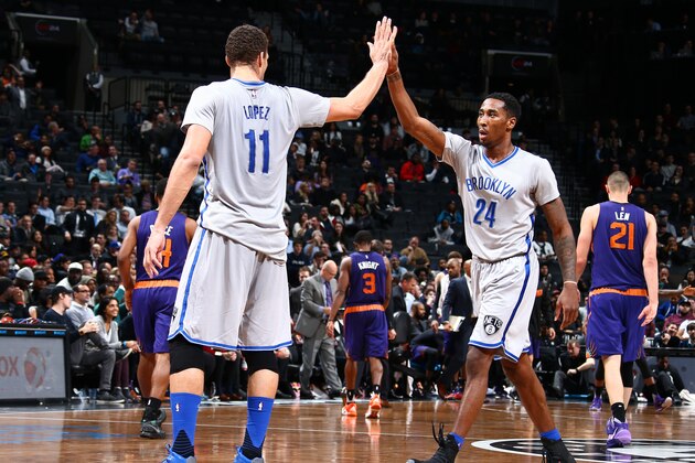 BROOKLYN, NY - DECEMBER 1: Brook Lopez #11 high fives Rondae Hollis-Jefferson #24 of the Brooklyn Nets during the game on December 1, 2015 at Barclays Center in Brooklyn, New York. NOTE TO USER: User expressly acknowledges and agrees that, by downloading and or using this Photograph, user is consenting to the terms and conditions of the Getty Images License Agreement. Mandatory Copyright Notice: Copyright 2015 NBAE (Photo by Nathaniel S. Butler/NBAE via Getty Images)