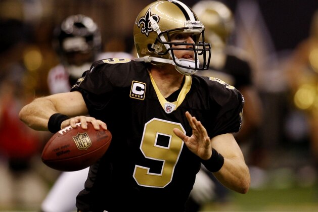 NEW ORLEANS - NOVEMBER 2:  Quarterback Drew Brees #12 of the New Orleans Saints looks to pass the ball against the Atlanta Falcons during the first quarter of the game at the Louisiana Superdome on November 2, 2009 in New Orleans, Louisiana. (Photo by Chris Graythen/Getty Images)