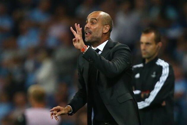 Manchester City's manager Pep Guardiola gestures towards his players during the Champions League group C soccer match at the Etihad Stadium between Manchester City and Borussia Moenchengladbach in Manchester, England, Wednesday, Sept. 14, 2016. The match was rearranged from Tuesday due to adverse weather conditions in Manchester.  (AP Photo/Dave Thompson)