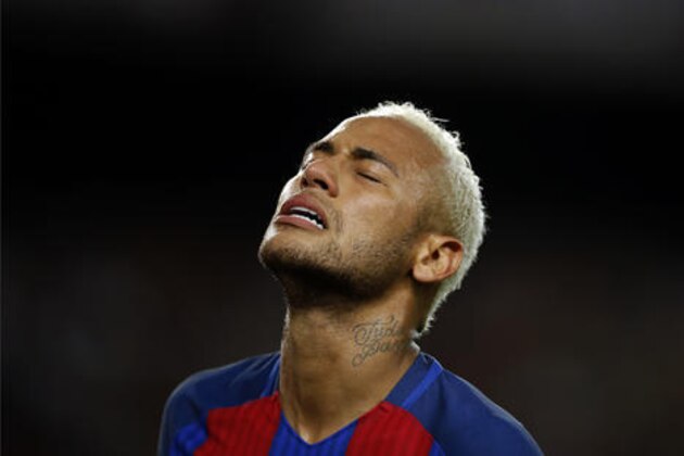 FC Barcelona's Neymar reacts during the Spanish La Liga soccer match between FC Barcelona and Atletico Madrid at the Camp Nou in Barcelona, Spain, Wednesday, Sept. 21, 2016. (AP Photo/Manu Fernandez)