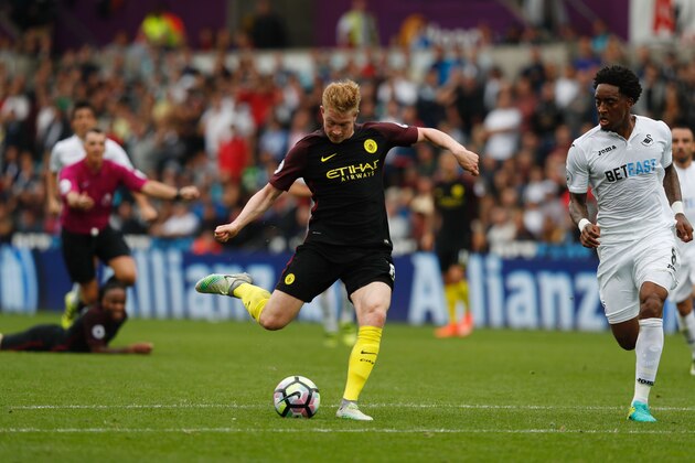 Manchester City's Belgian midfielder Kevin De Bruyne takes a shot that misses the target during the English Premier League football match between Swansea City and Manchester City at The Liberty Stadium in Swansea, south Wales on September 24, 2016. / AFP / Adrian DENNIS / RESTRICTED TO EDITORIAL USE. No use with unauthorized audio, video, data, fixture lists, club/league logos or 'live' services. Online in-match use limited to 75 images, no video emulation. No use in betting, games or single club/league/player publications.  /         (Photo credit should read ADRIAN DENNIS/AFP/Getty Images)