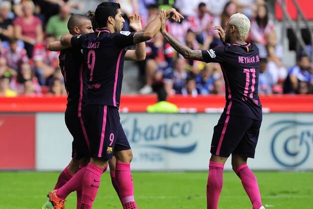 Barcelona's midfielder Rafael Alcantara (L) celebrates a goal with teammates Barcelona's Uruguayan forward Luis Suarez (2nd L) and Barcelona's Brazilian forward Neymar during the Spanish league football match Real Sporting de Gijon vs FC Barcelona at El Molinon stadium in Gijon on September 24, 2016. / AFP / ANDER GILLENEA        (Photo credit should read ANDER GILLENEA/AFP/Getty Images)