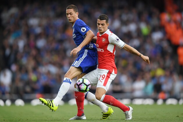 LONDON, ENGLAND - SEPTEMBER 24: Nemanja Matic of Chelsea (L) and Granit Xhaka of Arsenal (R) battle for possession  during the Premier League match between Arsenal and Chelsea at the Emirates Stadium on September 24, 2016 in London, England.  (Photo by Shaun Botterill/Getty Images)