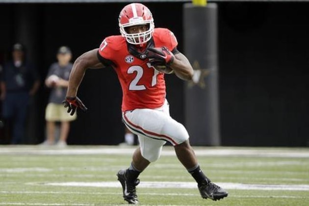 FILE - In this Sept. 12, 2015 file photo, Georgia running back Nick Chubb carries the ball against Vanderbilt in the first half of an NCAA college football game in Nashville, Tenn. No one player ever determines the fortunes of a team, although the quarterback is going to be important everywhere in the Southeastern Conference this season - except maybe Alabama. Six players, including Chubb, will play a big role in determining how things shake out in the SEC. (AP Photo/Mark Humphrey, File)