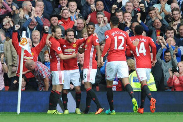 Manchester United's Juan Mata, 2nd left, celebrates with team mates after scoring during the English Premier League soccer match between Manchester United and Leicester City at Old Trafford in Manchester, England, Saturday, Sept. 24, 2016. (AP Photo/Rui Vieira)