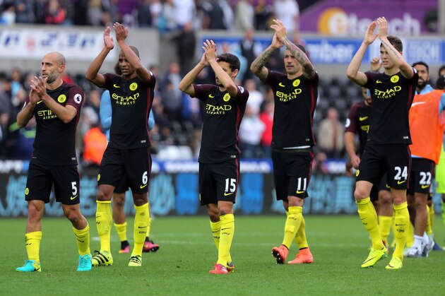 SWANSEA, WALES - SEPTEMBER 24: (L-R) Pablo Zabaleta, Fernando, Jesus Navas, Aleksandar Kolarov and John Stones of Manchester City thank their away supporters after the Premier League match between Swansea City and Manchester City at The Liberty Stadium on September 24, 2016 in Swansea, Wales. (Photo by Athena Pictures/Getty Images)