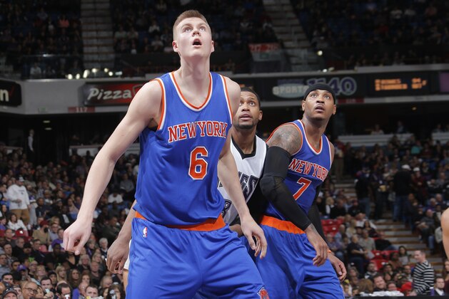 SACRAMENTO, CA - DECEMBER 10: Kristaps Porzingis #6 and Carmelo Anthony #7 of the New York Knicks box out Rudy Gay #8 of the Sacramento Kings on December 10, 2015 at Sleep Train Arena in Sacramento, California. NOTE TO USER: User expressly acknowledges and agrees that, by downloading and or using this photograph, User is consenting to the terms and conditions of the Getty Images Agreement. Mandatory Copyright Notice: Copyright 2015 NBAE (Photo by Rocky Widner/NBAE via Getty Images)