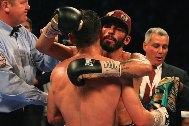 MANCHESTER, ENGLAND - SEPTEMBER 24:  Jorge Linares (cap) embraces Anthony Crolla as he is awarded victory after their contest for WBA, WBC Diamond and Ring Magazine Lightweight World Titlesat Manchester Arena on September 24, 2016 in Manchester, England.  (Photo by Ben Hoskins/Getty Images)