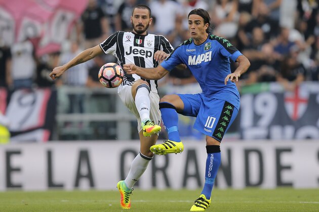 Juventus' defender Leonardo Bonucci (L) challenges Sassuolo's forward Alessandro Matri during the Italian Serie A football match between Juventus and Sassuolo on September 10, 2016 at the Juventus Stadium in Turin.  / AFP / MARCO BERTORELLO        (Photo credit should read MARCO BERTORELLO/AFP/Getty Images)