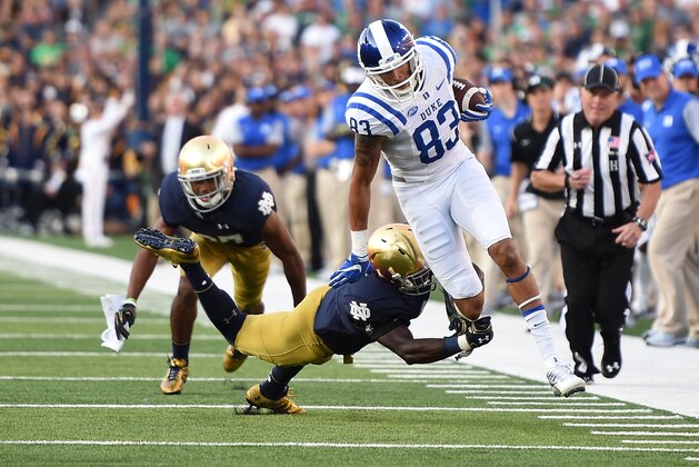 SOUTH BEND, IN - SEPTEMBER 24:  Anthony Nash #83 of the Duke Blue Devils is tripped up by Daelin Hayes #9 of the Notre Dame Fighting Irish during the second half of a game at Notre Dame Stadium on September 24, 2016 in South Bend, Indiana.  Duke defeated Notre Dame 38-35. (Photo by Stacy Revere/Getty Images)