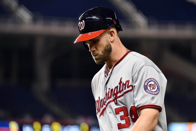 Sep 20, 2016; Miami, FL, USA; Washington Nationals right fielder Bryce Harper (34) walks back to the dugout after lined out to Miami Marlins left fielder Christian Yelich (not pictured) during the fourth inning at Marlins Park. The Marlins won 1-0. Mandatory Credit: Steve Mitchell-USA TODAY Sports