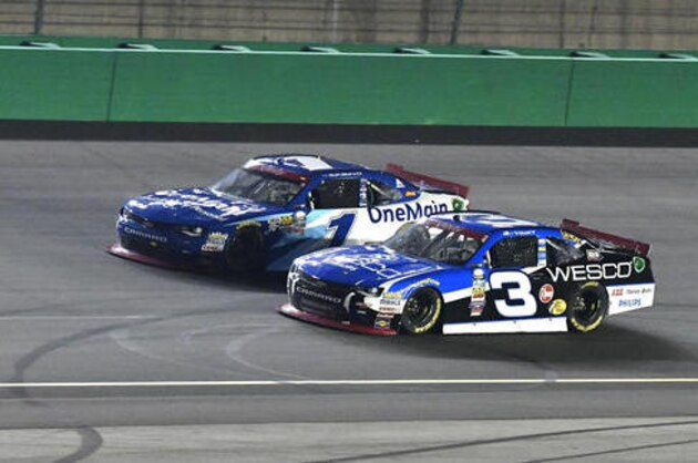 Ty Dillon (3) attempts to pass Elliott Sadler (1) during the Xfinity Series autor race, Saturday, Sept. 24, 2016, in Sparta Ky. (AP Photo/Timothy D. Easley)