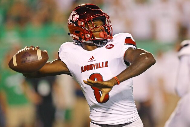 Sep 24, 2016; Huntington, WV, USA; Louisville Cardinals quarterback Lamar Jackson (8) throws a pass for a touchdown to wide receiver James Quick (not pictured) against the Marshall Thundering Herd in the first half at Joan C. Edwards Stadium. Mandatory Credit: Aaron Doster-USA TODAY Sports