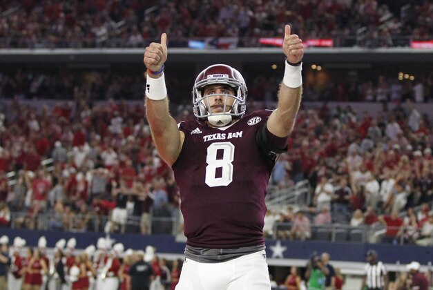 Sep 24, 2016; Dallas, TX, USA;  Texas A&M Aggies quarterback Trevor Knight (8) celebrates scoring a touchdown in the second quarter against the Arkansas Razorbacks at AT&T Stadium. Mandatory Credit: Tim Heitman-USA TODAY Sports