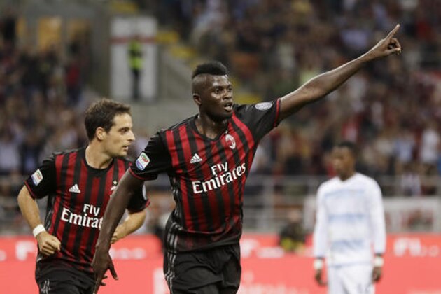 AC Milan's Mbaye Niang celebrates after scoring during the Serie A soccer match between AC Milan and Lazio at the San Siro stadium in Milan, Italy, Tuesday, Sept. 20, 2016. (AP Photo/Antonio Calanni)