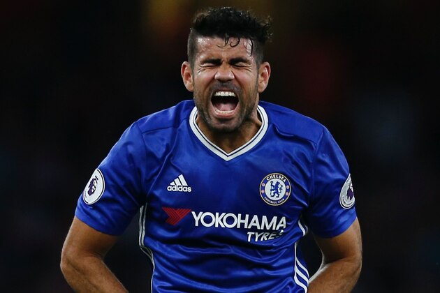 Chelsea's Brazilian-born Spanish striker Diego Costa reacts during the English Premier League football match between Arsenal and Chelsea at The Emirates stadium in London, on September 24, 2016. / AFP / IKIMAGES / Ian Kington / RESTRICTED TO EDITORIAL USE. No use with unauthorized audio, video, data, fixture lists, club/league logos or 'live' services. Online in-match use limited to 45 images, no video emulation. No use in betting, games or single club/league/player publications.        (Photo credit should read IAN KINGTON/AFP/Getty Images)