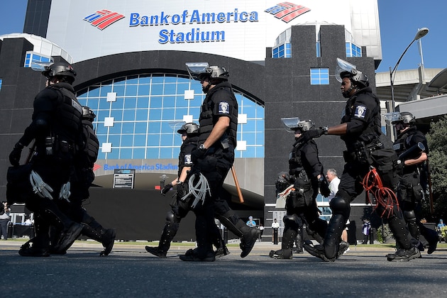 CHARLOTTE, NC - SEPTEMBER 25:  Charlotte Mecklenburg Police Department deploy outside of Bank of America Stadium prior to the game between the Carolina Panthers and the Minnesota Vikings on September 25, 2016 in Charlotte, North Carolina. Charlotte has been the site of civil unrest since Keith Lamont Scott, 43, was shot and killed by police officers at an apartment complex near UNC Charlotte on September 25, 2016.  (Photo by Grant Halverson/Getty Images)