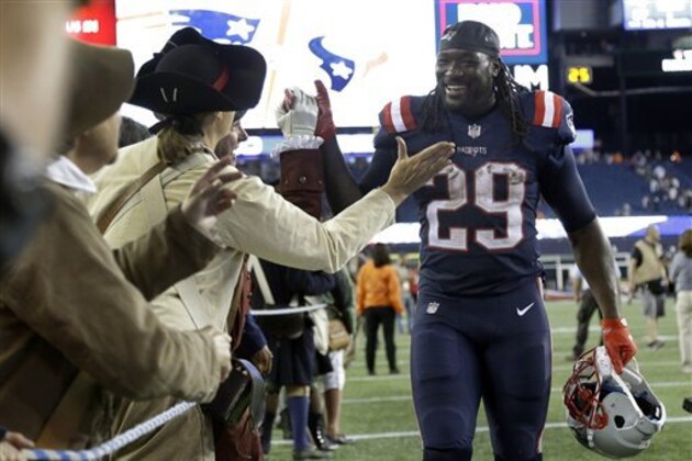 New England Patriots running back LeGarrette Blount (29) celebrates The Patriots 27-0 win over the Houston Texans with members of the End Zone Militia after an NFL football game Thursday, Sept. 22, 2016, in Foxborough, Mass. (AP Photo/Elise Amendola)