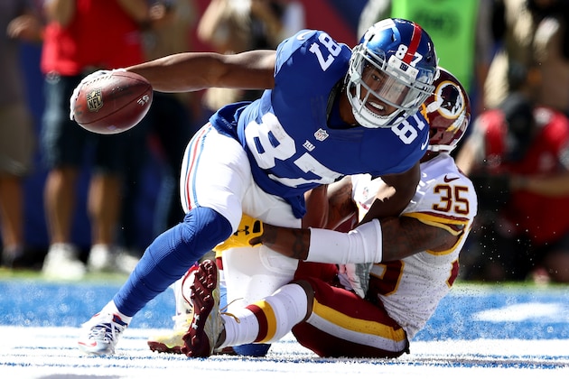 EAST RUTHERFORD, NJ - SEPTEMBER 25:  Sterling Shepard #87 of the New York Giants scores a touchdown in the first quarter as  Dashaun Phillips #35 of the Washington Redskins defends at MetLife Stadium on September 25, 2016 in East Rutherford, New Jersey.  (Photo by Elsa/Getty Images)