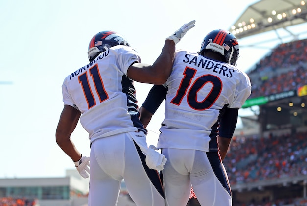 Sep 25, 2016; Cincinnati, OH, USA; Denver Broncos wide receiver Jordan Norwood (11) celebrates the touchdown scored by wide receiver Emmanuel Sanders (10) against the Cincinnati Bengals in the first half at Paul Brown Stadium. Mandatory Credit: Aaron Doster-USA TODAY Sports