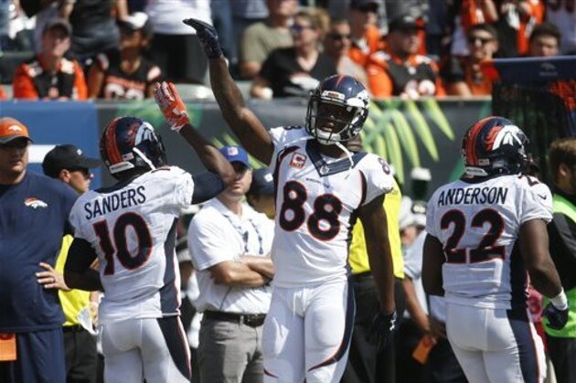 Denver Broncos wide receiver Emmanuel Sanders (10) celebrates his touchdown with wide receiver Demaryius Thomas (88) during the first half of an NFL football game against the Cincinnati Bengals, Sunday, Sept. 25, 2016, in Cincinnati. (AP Photo/Frank Victores)