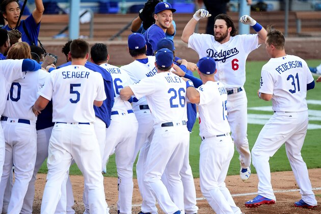 LOS ANGELES, CA - SEPTEMBER 25:  Charlie Culberson #6 of the Los Angeles Dodgers celebrates his solo homerun for a 4-3 win over the Colorado Rockies during the tenth inning at Dodger Stadium on September 25, 2016 in Los Angeles, California.  The Los Angeles Dodgers clinch the division with the win.  (Photo by Harry How/Getty Images)