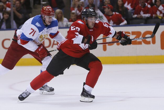 Sep 24, 2016; Toronto, Ontario, Canada; Team Canada forward Brad Marchand (63)  outskates Team Russia forward Evgeny Malkin (71) during a semifinal game in the 2016 World Cup of Hockey at Air Canada Centre. Canada defeated Russia 5-3. Mandatory Credit: John E. Sokolowski-USA TODAY Sports