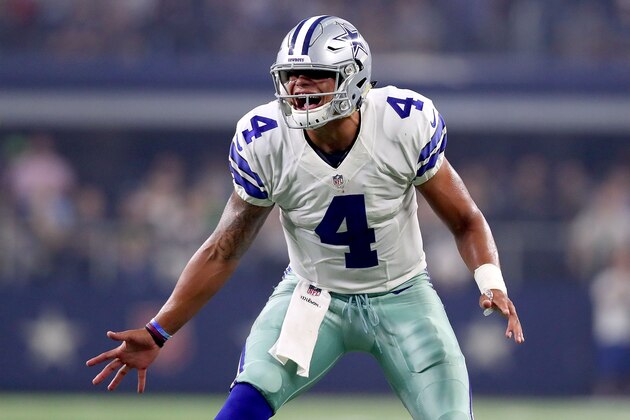 ARLINGTON, TX - SEPTEMBER 25:  Dak Prescott #4 of the Dallas Cowboys reacts after throwing for a touchdown during a game between the Dallas Cowboys and the Chicago Bears at AT&T Stadium on September 25, 2016 in Arlington, Texas.  (Photo by Tom Pennington/Getty Images)