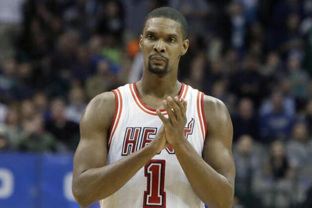 FILE - In this Feb. 3, 2016, file photo, Miami Heat forward Chris Bosh (1) reacts to a call during the second half of an NBA basketball game against the Dallas Mavericks, in Dallas. Bosh was dealing with more than one blood clot earlier this year, and said Wednesday, Sept. 21, 2016,  that he felt written off when Miami Heat team doctors advised him that the situation would likely be career-ending. (AP Photo/LM Otero, File)