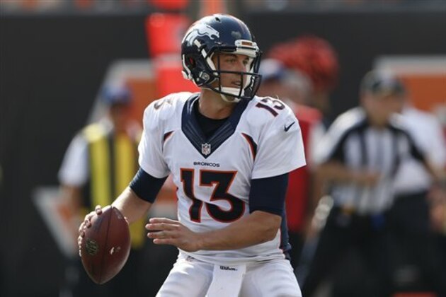 Denver Broncos quarterback Trevor Siemian (13) looks to hand off the ball during the second half of an NFL football game against the Cincinnati Bengals, Sunday, Sept. 25, 2016, in Cincinnati. (AP Photo/Frank Victores)