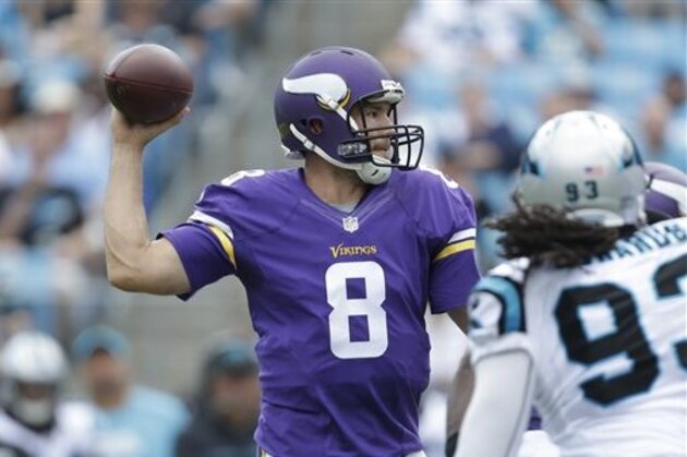 Minnesota Vikings' Sam Bradford (8) looks to pass against the Carolina Panthers in the second half of an NFL football game in Charlotte, N.C., Sunday, Sept. 25, 2016. (AP Photo/Bob Leverone)
