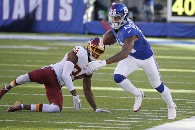 New York Giants wide receiver Odell Beckham Jr. (13) runs away from Washington Redskins' Josh Norman (24) during the second half of an NFL football game, Sunday, Sept. 25, 2016, in East Rutherford, N.J. (AP Photo/Kathy Willens)