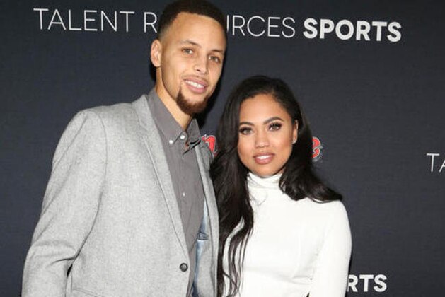 FILE - In this Feb. 6, 2016 file photo, NBA basketball player Stephen Curry, left, and his wife Ayesha Curry arrive at the Super Bowl 50 Rolling Stone Party in San Francisco. Ayesha Curry launched her first cookbook,
