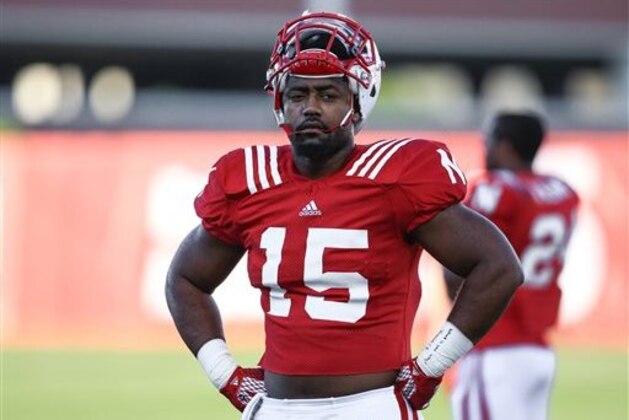 In this Tuesday, Aug. 11, 2015, photo, Nebraska linebacker Michael Rose-Ivey (15) warms up during NCAA college football practice in Lincoln, Neb. A year after he blew out a knee, Michael Rose-Ivey is back in his role as a starting linebacker for Nebraska. (AP Photo/Nati Harnik)