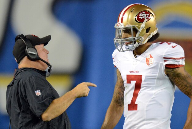 Sep 1, 2016; San Diego, CA, USA;  San Francisco 49ers head coach Chip Kelly talks to quarterback Colin Kaepernick (7) during the second quarter against the San Diego Chargers at Qualcomm Stadium. Mandatory Credit: Jake Roth-USA TODAY Sports