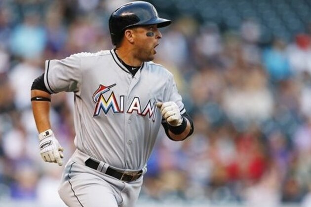 Miami Marlins' Martin Prado runs to first during the first inning of a baseball game against the Colorado Rockies, Saturday, Aug. 6, 2016, in Denver. (AP Photo/Jack Dempsey)