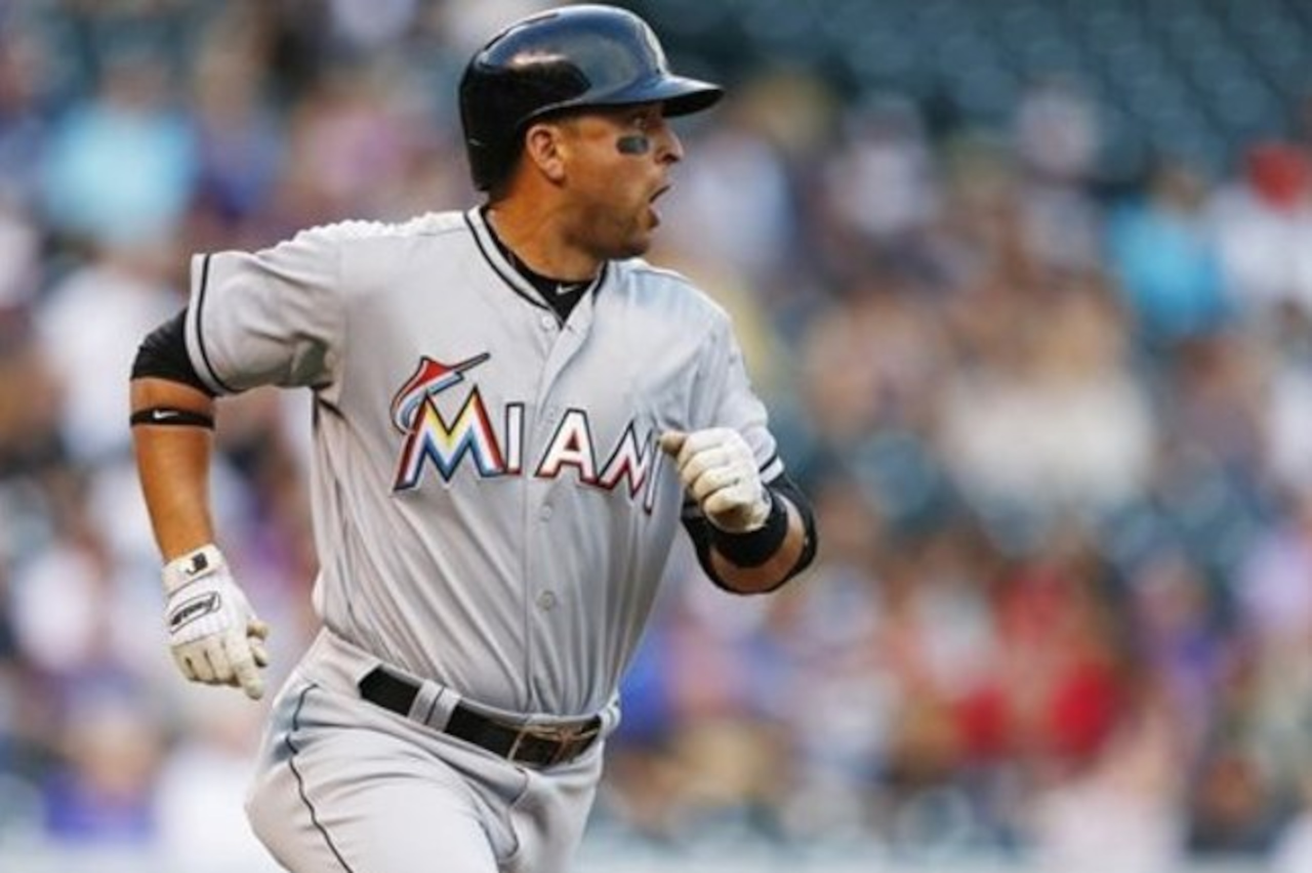 Miami Marlins' Martin Prado runs to first during the first inning of a baseball game against the Colorado Rockies, Saturday, Aug. 6, 2016, in Denver. (AP Photo/Jack Dempsey)