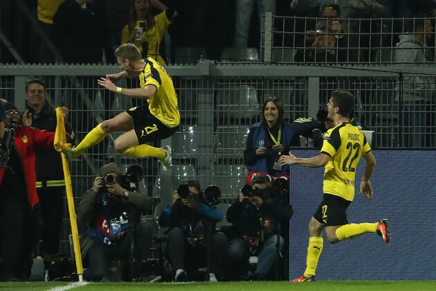Dortmund's midfielder Andre Schuerrle (L) reacts after scoring during the UEFA Champions League first leg football match between Borussia Dortmund and Real Madrid at BVB stadium in Dortmund, on September 27, 2016. / AFP / Odd ANDERSEN        (Photo credit should read ODD ANDERSEN/AFP/Getty Images)