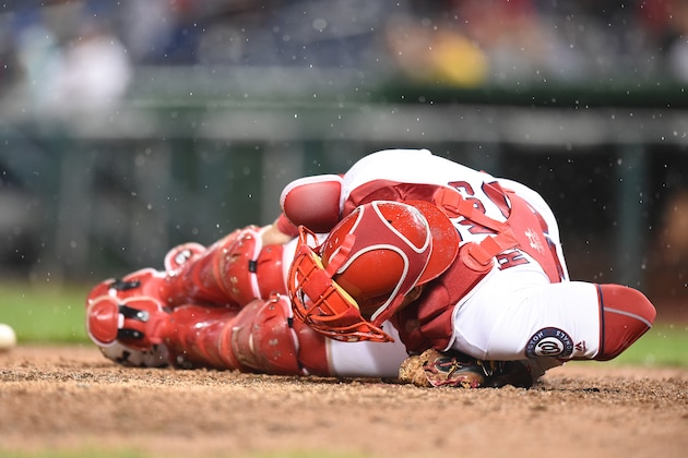 WASHINGTON, DC - SEPTEMBER 26:  Wilson Ramos #40 of the Washington Nationals lies in pain after slipping on play at the plate in the fifth inning during a baseball game against the Arizona Diamondbacks at Nationals Park on September 26, 2016 in Washington, DC.  (Photo by Mitchell Layton/Getty Images)