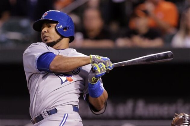 Toronto Blue Jays' Edwin Encarnacion doubles in the first inning of a baseball game against the Baltimore Orioles, Tuesday, Sept. 16, 2014, in Baltimore. Jose Bautista scored on the play. (AP Photo/Patrick Semansky)