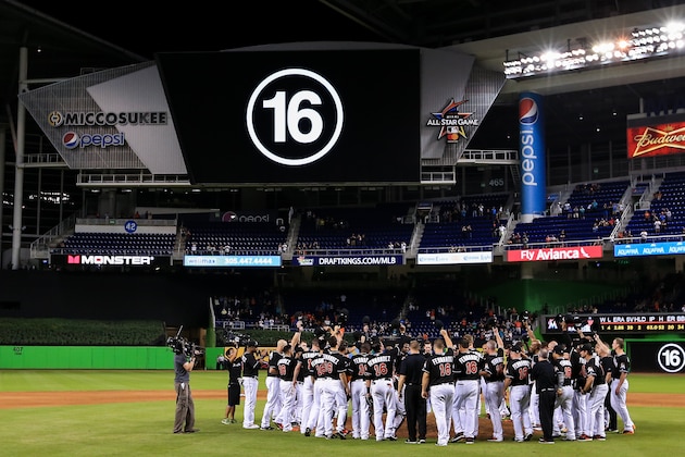 MIAMI, FL - SEPTEMBER 26: Miami Marlins players all wearing jerseys bearing the number 16 and name Fernandez honor the late Jose Fernandez after the game against the New York Mets at Marlins Park on September 26, 2016 in Miami, Florida. (Photo by Rob Foldy/Getty Images)