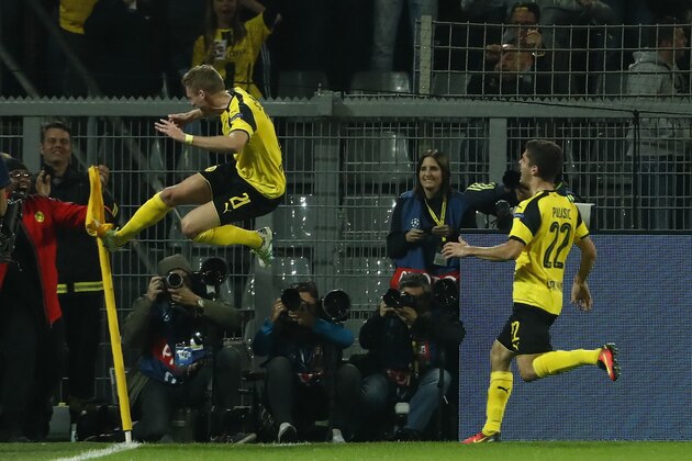 Dortmund's midfielder Andre Schuerrle (L) reacts after scoring during the UEFA Champions League first leg football match between Borussia Dortmund and Real Madrid at BVB stadium in Dortmund, on September 27, 2016. / AFP / Odd ANDERSEN        (Photo credit should read ODD ANDERSEN/AFP/Getty Images)