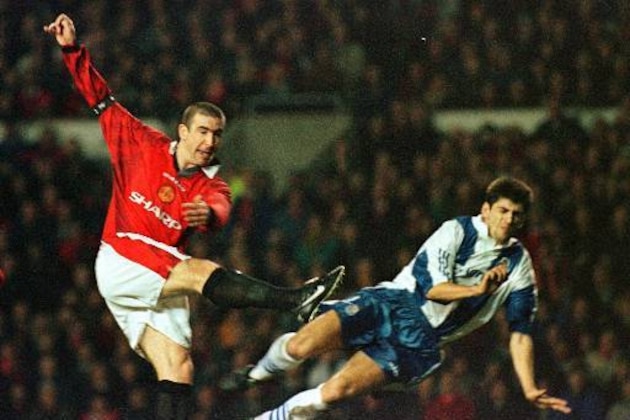 Manchester United's Eric Cantona hammers the ball past FC Porto's Alosio, to score his teams second goal, Wednesday 5 March 1997 during the UEFA Champions Cup quarterfinals 1st leg soccer match played at Old Trafford in Manchester. Manchester United won the match 4-0. (AP Photo/Max Nash)