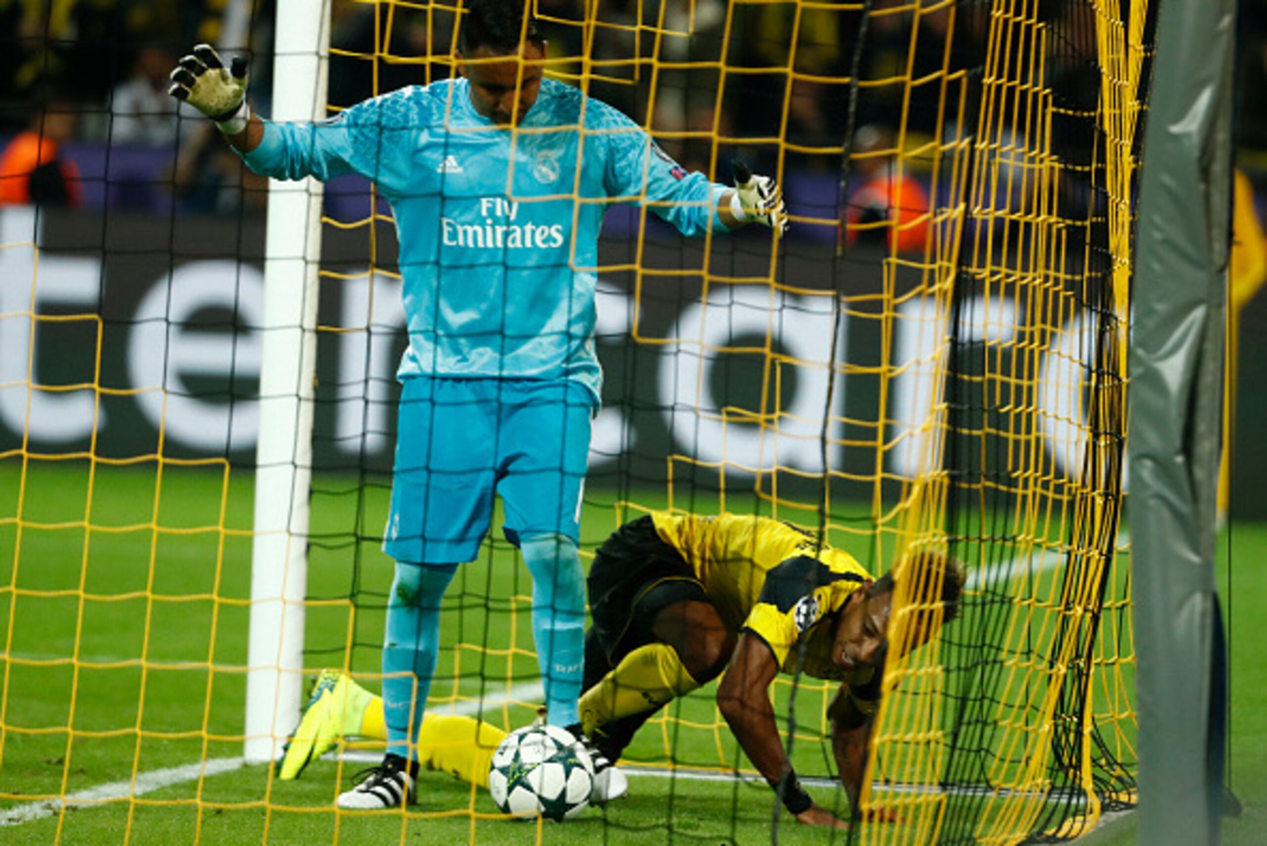 Dortmund's Gabonese forward Pierre-Emerick Aubameyang reacts after scoring past Real Madrid's Costa Rican goalkeeper Keylor Navas during the UEFA Champions League first leg football match between Borussia Dortmund and Real Madrid at BVB stadium in Dortmund, on September 27, 2016. / AFP / Odd ANDERSEN        (Photo credit should read ODD ANDERSEN/AFP/Getty Images)