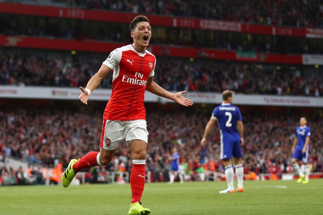 LONDON, ENGLAND - SEPTEMBER 24:  Mesut Ozil of Arsenal celebrates scoring his sides third goal during the Premier League match between Arsenal and Chelsea at the Emirates Stadium on September 24, 2016 in London, England.  (Photo by Paul Gilham/Getty Images)