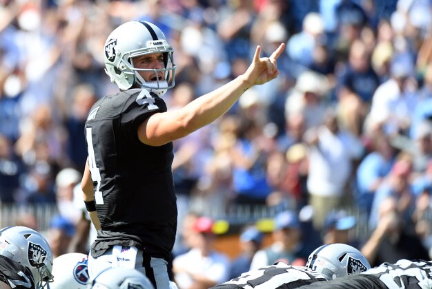 Sep 25, 2016; Nashville, TN, USA; Oakland Raiders quarterback Derek Carr (4) calls plays at the line during the first half against the Tennessee Titans at Nissan Stadium. Mandatory Credit: Christopher Hanewinckel-USA TODAY Sports